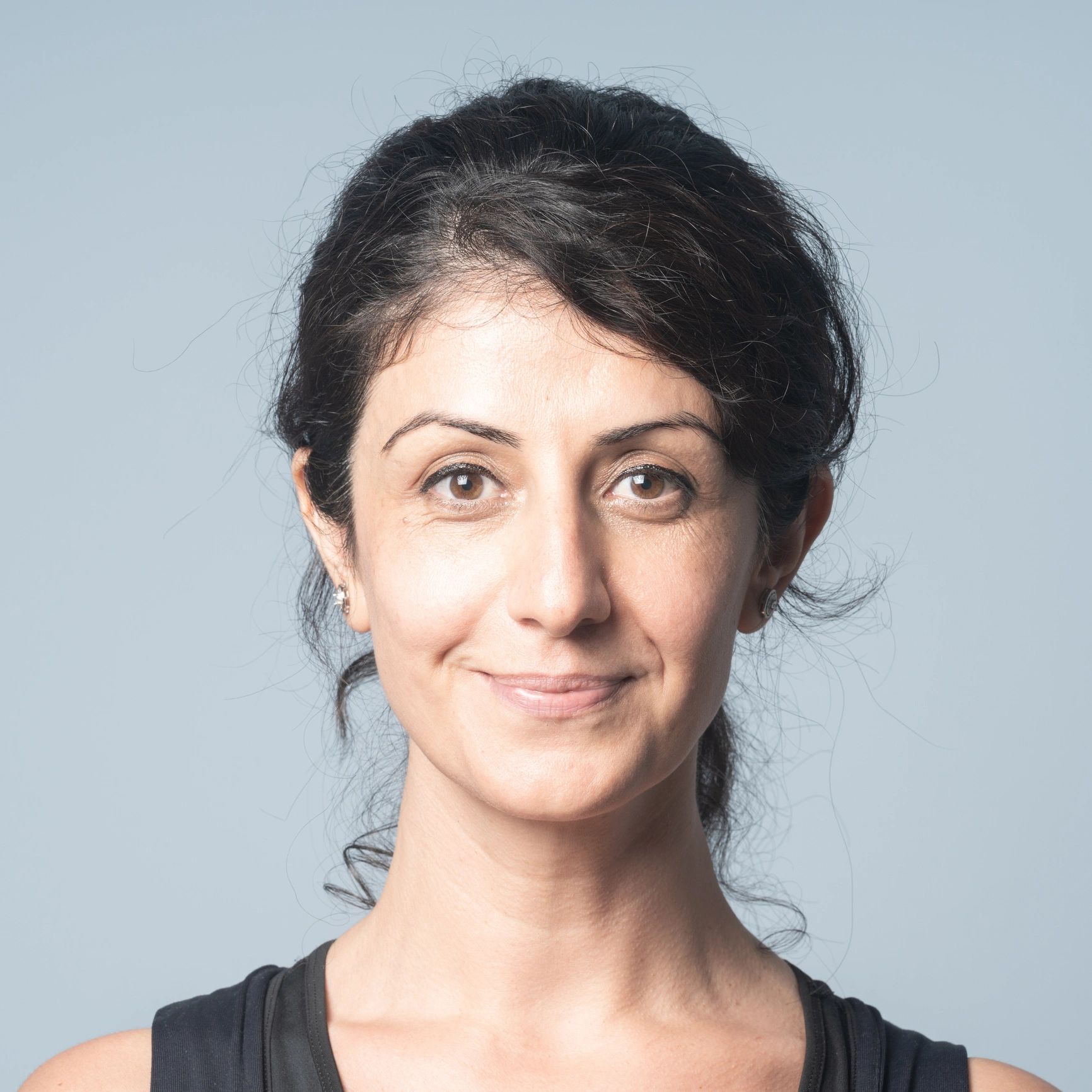 Professional headshot of a smiling woman
